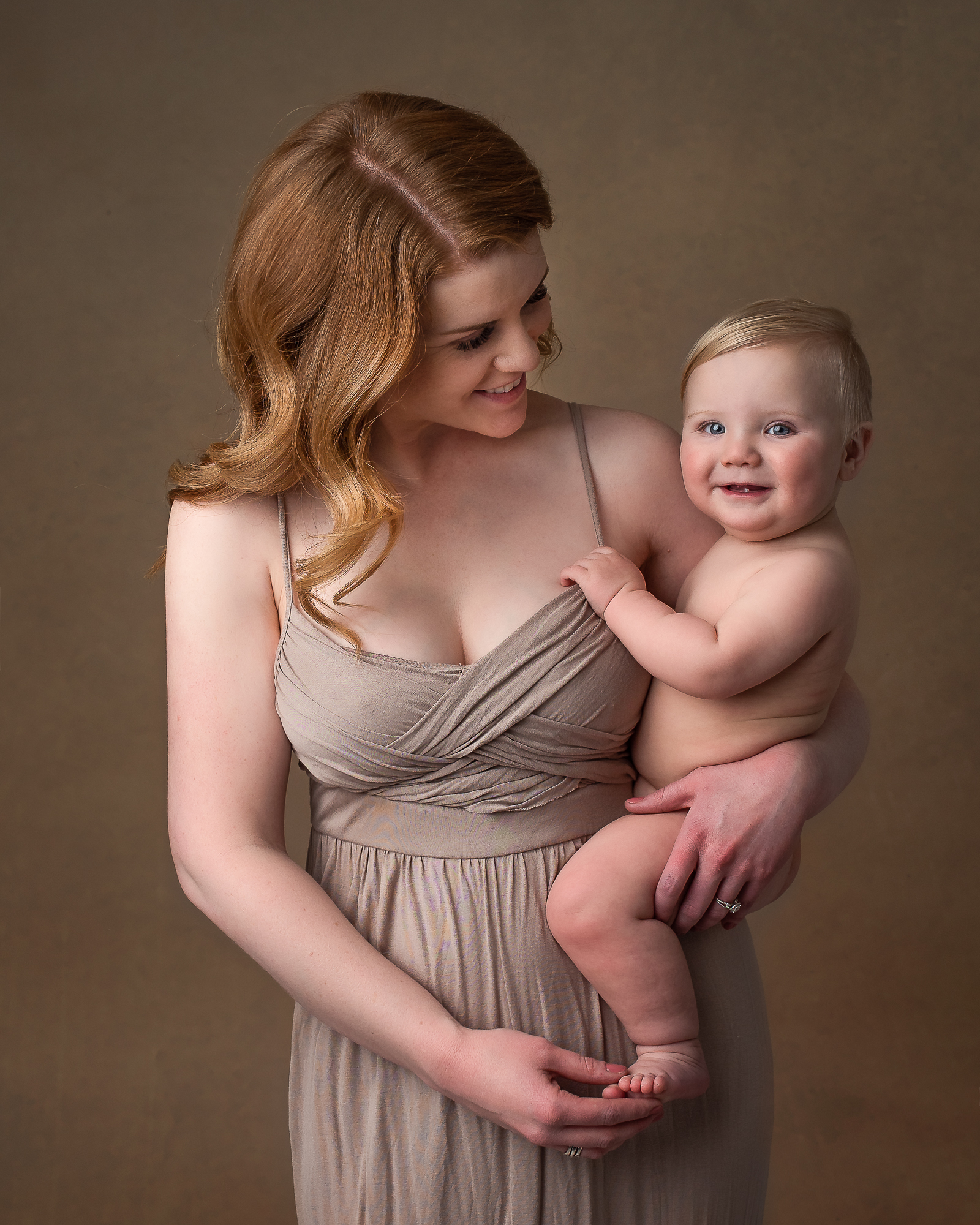 new mom holding her child Medford Women’s Clinic