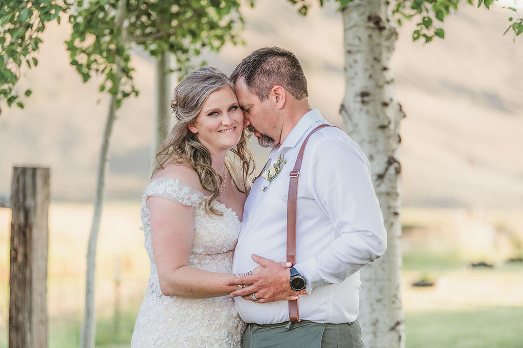 groom nuzzling with his bride at Southern Oregon Wedding Venues